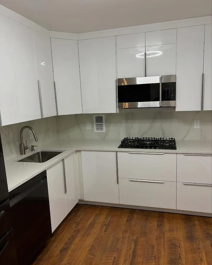 Restored kitchen with white cabinets after water damage in Peppermill Village